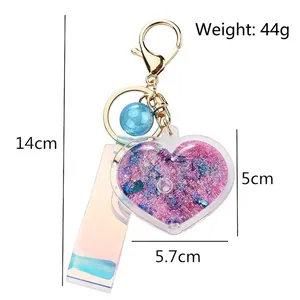 Holographic heart liquid quicksand keychain with pink sequins and purple wrist strap
