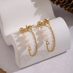 Elegant natural freshwater pearl tassel earrings in gold with a modern minimalist design