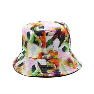 Double-sided cotton bucket hat featuring vibrant graffiti art print and wide brim