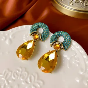 Vintage gold drop earrings with turquoise pavé top and faceted yellow crystal pendants