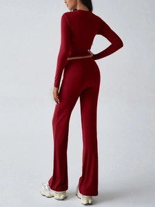 Back view of burgundy Y2K slim long sleeve top and flared trousers two-piece set