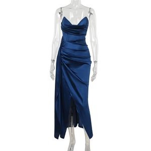 Detail of elegant navy blue satin dress showing pleated fabric texture and sexy front slit