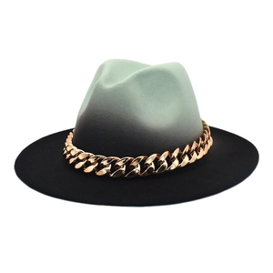 Detail of grey-green gradient wool fedora hat with bold gold metal chain accent