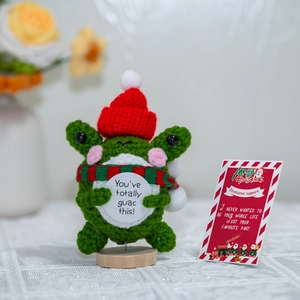 Handmade crochet Christmas cucumber doll with festive hat, scarf and support card