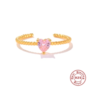Detailed close-up of S925 sterling silver heart ring with pink gemstone and gold texture
