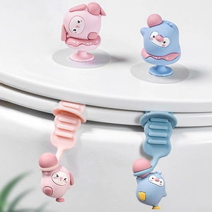 Close-up of cute cartoon rabbit and penguin toilet lid lifters in pink and blue colors
