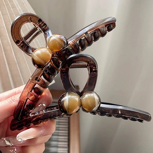 Brown amber acrylic large hair claw clips with marble bead detail for women