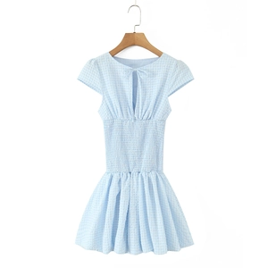 Detail of light blue plaid dress showing smocked waist and back tie-up cut-out design