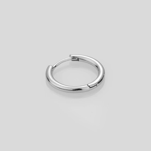 Macro view of polished S925 sterling silver hoop earrings with minimalist metal finish