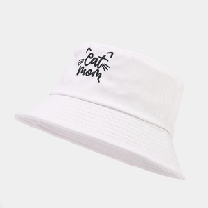 Detailed close-up of Cat Mom embroidery on white cotton sun hat with firm stitching