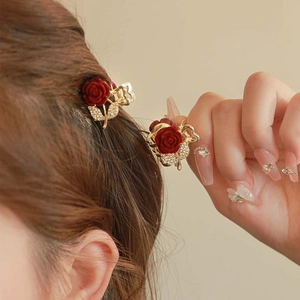 Mini flocked red rose hair claw clip with rhinestones shown on model hair