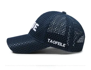 Detail view of breathable navy blue mesh baseball cap with white letter embroidery