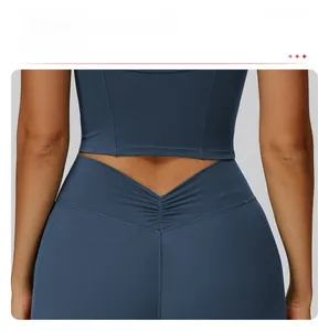 Detail of high-waisted yoga shorts with deep V-shaped back and ruched slimming seam