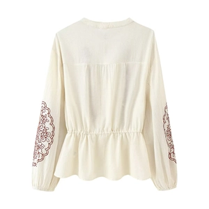 Bohemian off-white long sleeve top with mandala embroidery and ruffle waist detail