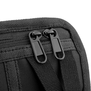 Detail of durable dual metal zippers and high-density nylon webbing on tactical chest bag