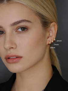 Detailed comparison of 6mm, 7mm, and 8mm gold wide hoop earrings worn on ear