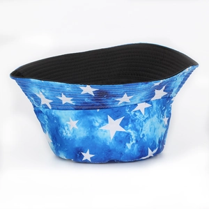 Blue tie-dye bucket hat with white star patterns and black interior lining for outdoor sun protection