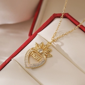 Gold heart MOM pendant necklace with zircons displayed in a classic jewelry gift box