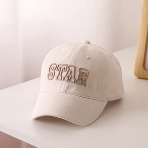 Detail of beige cotton baseball cap featuring high-quality 3D STAR letter embroidery