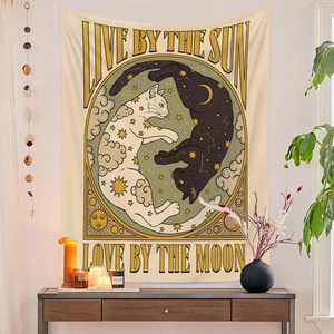 Detail of bohemian tapestry featuring Live by the Sun and Love by the Moon tarot design