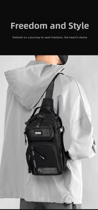 Detail of black nylon crossbody bag with multiple zipper pockets and wide shoulder strap