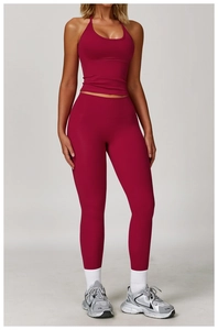 Detailed back view of burgundy high-waist yoga leggings and halter neck sports bra