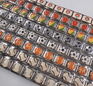 Detail view of Italian modular charms featuring colorful sports ball designs on steel links