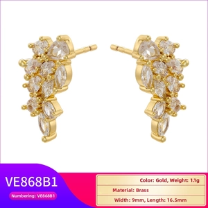 Detailed close-up of gold plated brass stud earrings featuring marquise-cut cubic zirconia