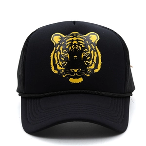 Close-up of golden tiger head print on a black mesh trucker hat with breathable structure