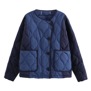 Quilted blue contrast panel jacket with round neck and front pockets in flat lay view