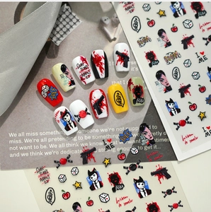 Detail of dark graffiti nail art stickers with punk street style patterns on nails