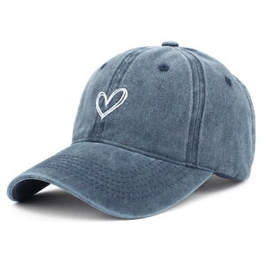 Detailed view of white heart embroidery on a vintage washed navy denim baseball cap