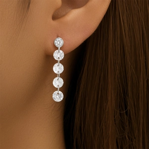 Close-up of S925 silver tassel drop earrings featuring sparkling cubic zirconia stones