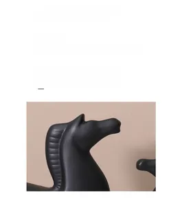 Detailed close-up of modern black matte ceramic horse sculpture with smooth minimalist lines