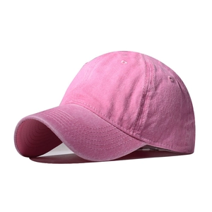 Close-up of pink washed cotton baseball cap texture and reinforced stitching details