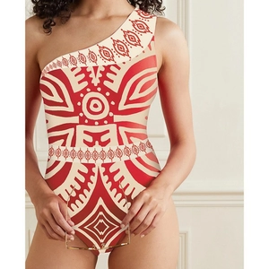 One-shoulder ethnic print swimsuit featuring geometric red and beige patterns for beachwear