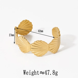 Detail view of gold seashell cuff bracelet showing 27mm width and 62mm inner diameter