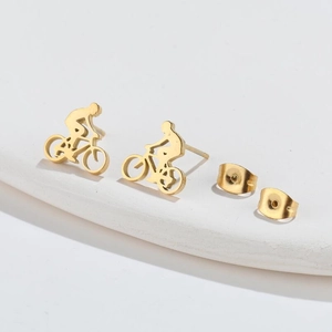 Polished gold bicycle stud earrings with butterfly backs in a minimalist geometric style