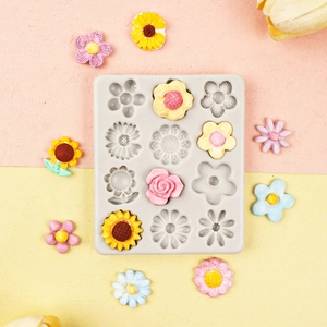 Grey silicone flower mold with 12 cavities for rose and daisy fondant cake decorations