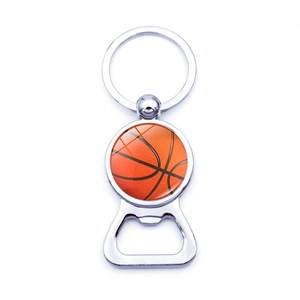 Detail of metal bottle opener keychain with a 3D basketball graphic in polished finish