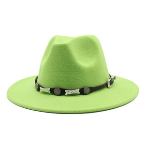 Close-up of bright green fedora with black leather band and silver star accents