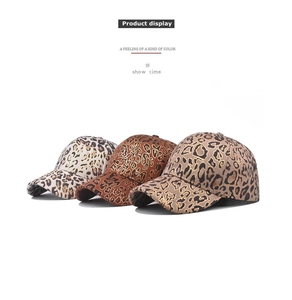 Detailed display of leopard print baseball caps in gold foil and faux suede textures