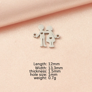 Detail view of 12mm stainless steel boy and girl charm with dimensions on pink silk
