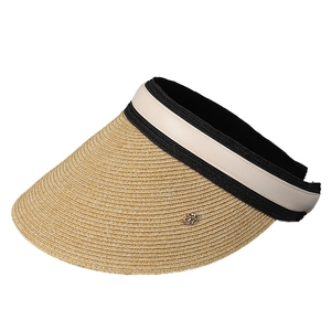 Women's straw sun visor with wide brim and elegant black and white ribbon decoration