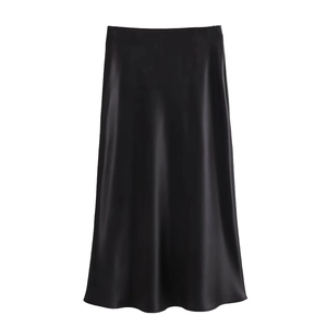 Detail of elegant black satin midi skirt featuring silky texture and A-line silhouette