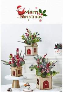 Close-up of wooden Christmas house decor with artificial berries, pine needles and snow