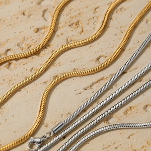 Minimalist gold and silver layered snake chain necklaces with lobster clasp finish