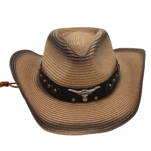 Detail of cowboy straw hat with bull head ornament and vintage leather band decoration