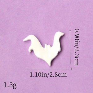 Macro detail of white bat resin accessory with dimensions for Halloween DIY crafts