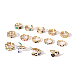 Collection of gold 18k plated enamel rings featuring snake and geometric designs